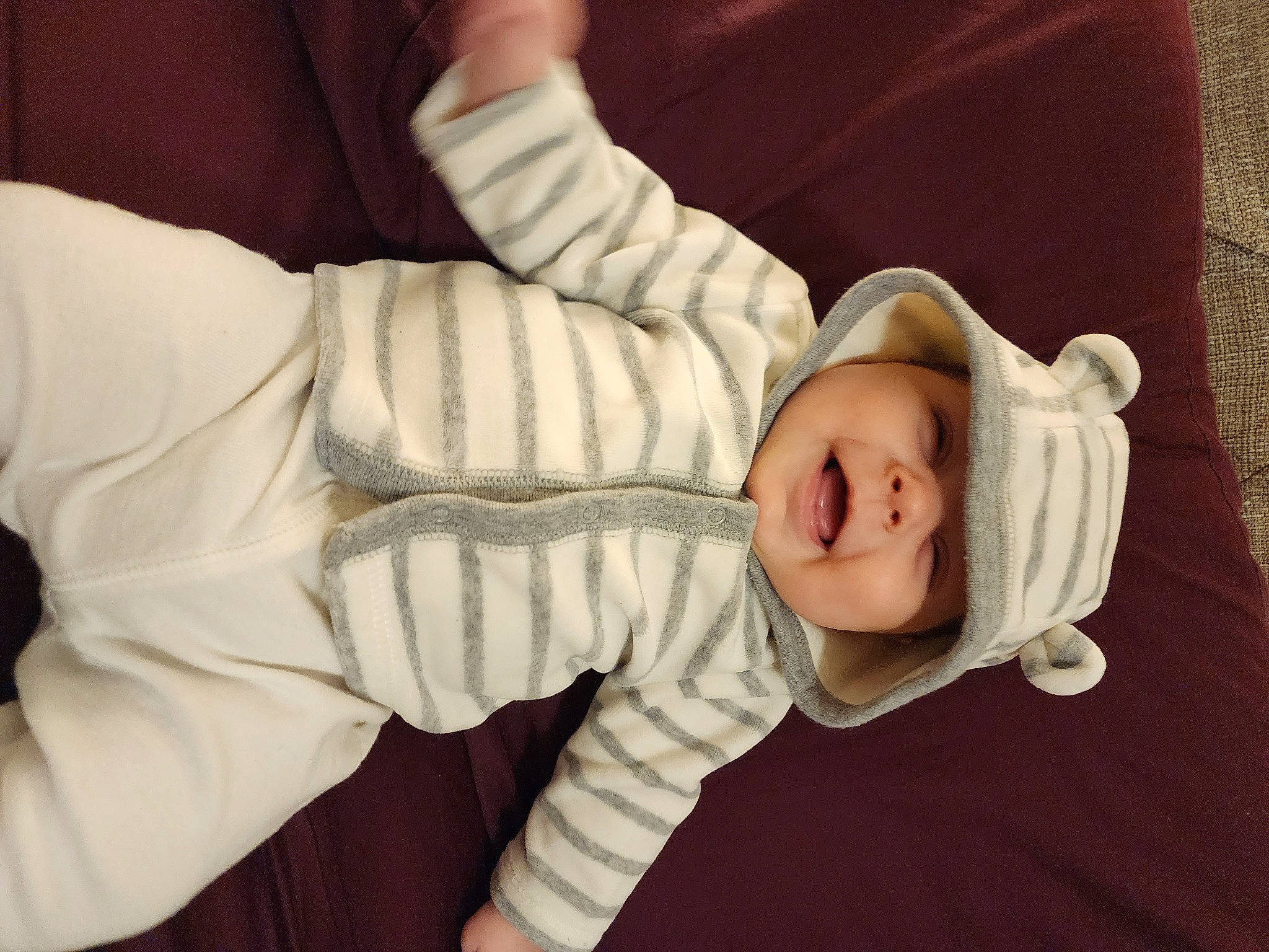 Ethan Phillips is registered to the contest to win money with this photo: baby, baby_products, baby_sleeping, baby_toddler_clothing, cheek, child, comfort, elbow, gesture, headwear, human_body, leg, linens, person, portrait_photography, room, sitting, sleep, sleeve, thumb