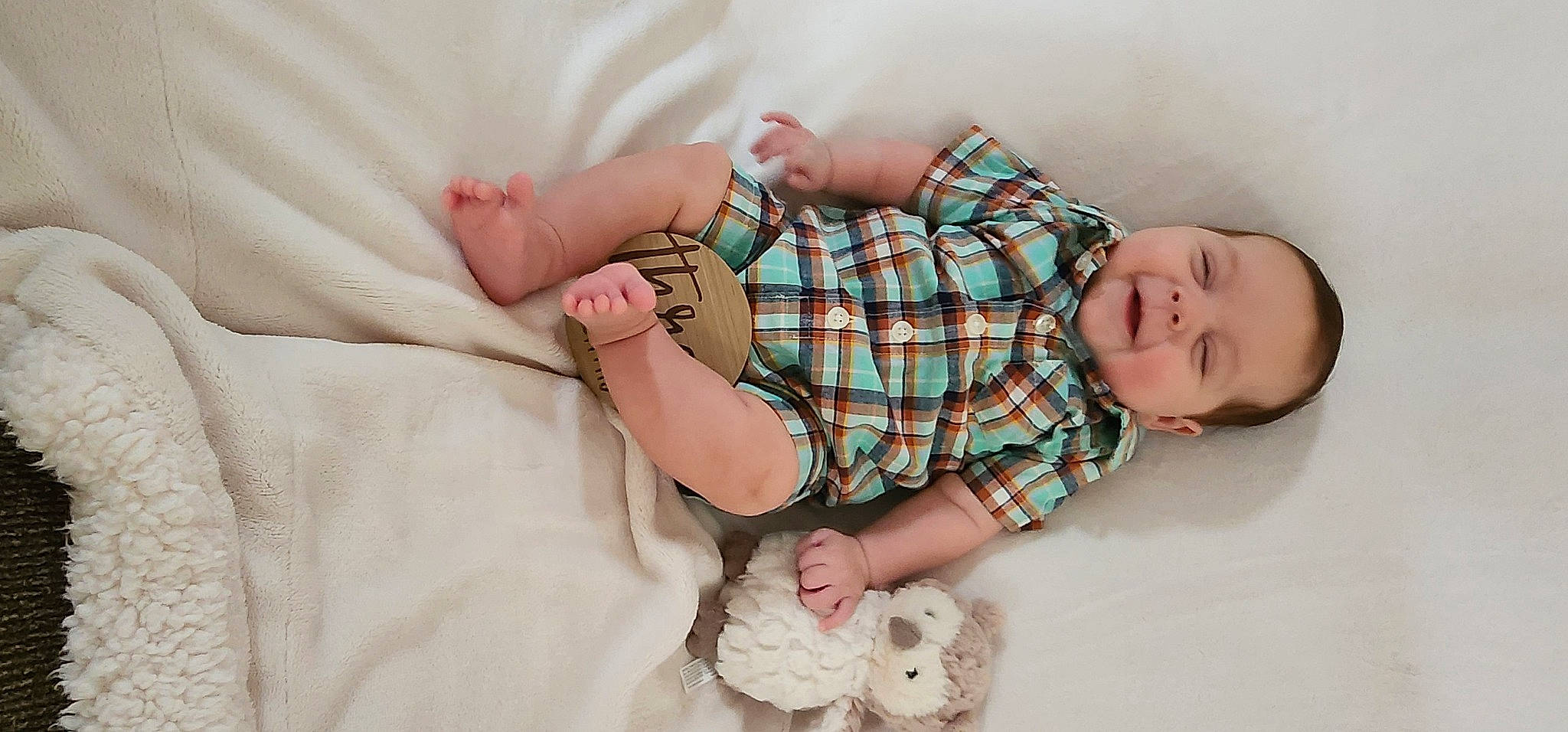 Ethan Phillips joined the competition — help win amazing prizes! arm, baby, baby_sleeping, baby_toddler_clothing, collar, comfort, finger, gesture, hand, human_body, joint, joy, leg, linens, nail, pattern, person, plaid, skin, sleeve