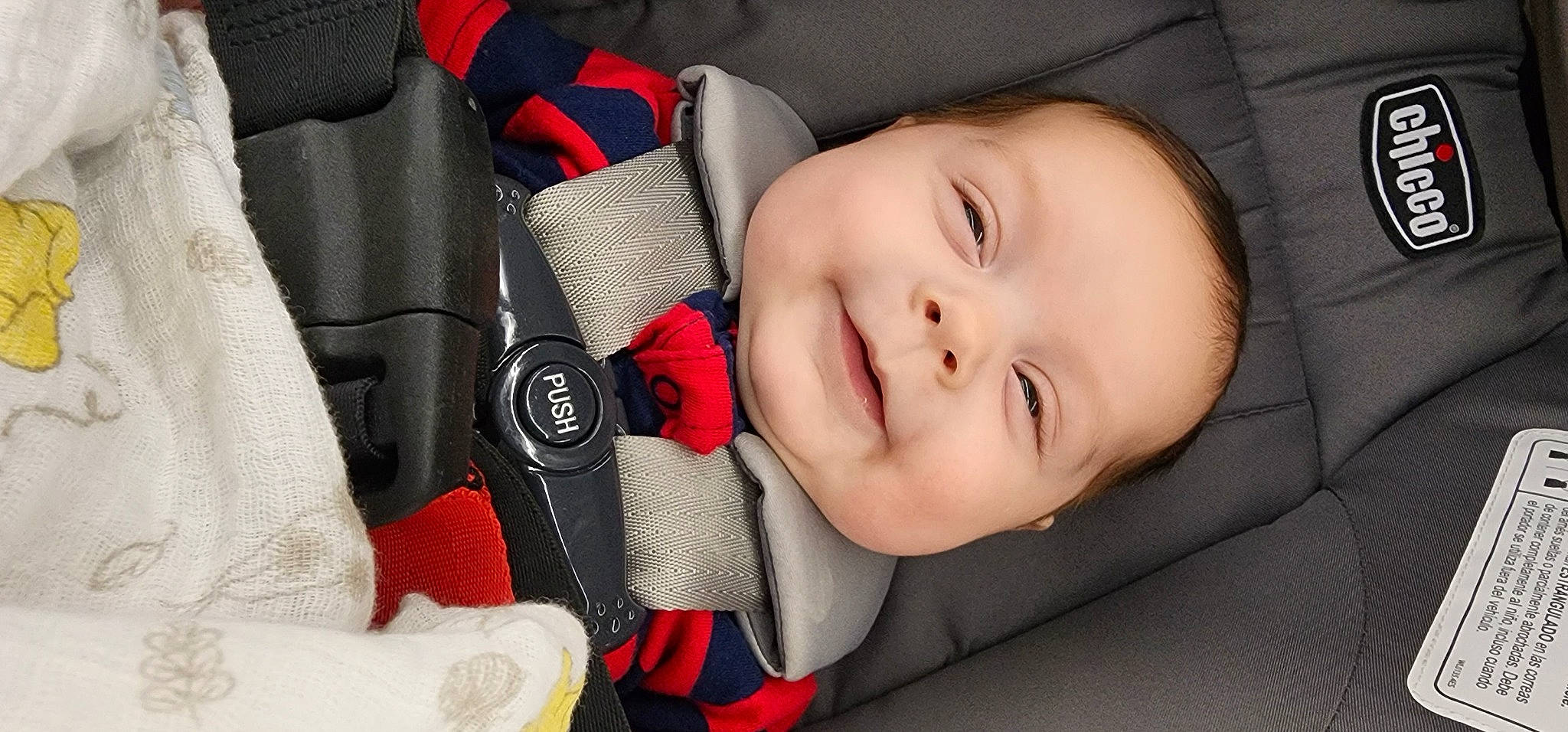 Ethan Phillips is registered to the contest to win money with this photo: auto_part, baby, baby_carriage, baby_toddler_clothing, car_seat, cheek, comfort, eyebrow, face, finger, flash_photography, joy, lip, mammal, mouth, nose, person, product, skin, smile
