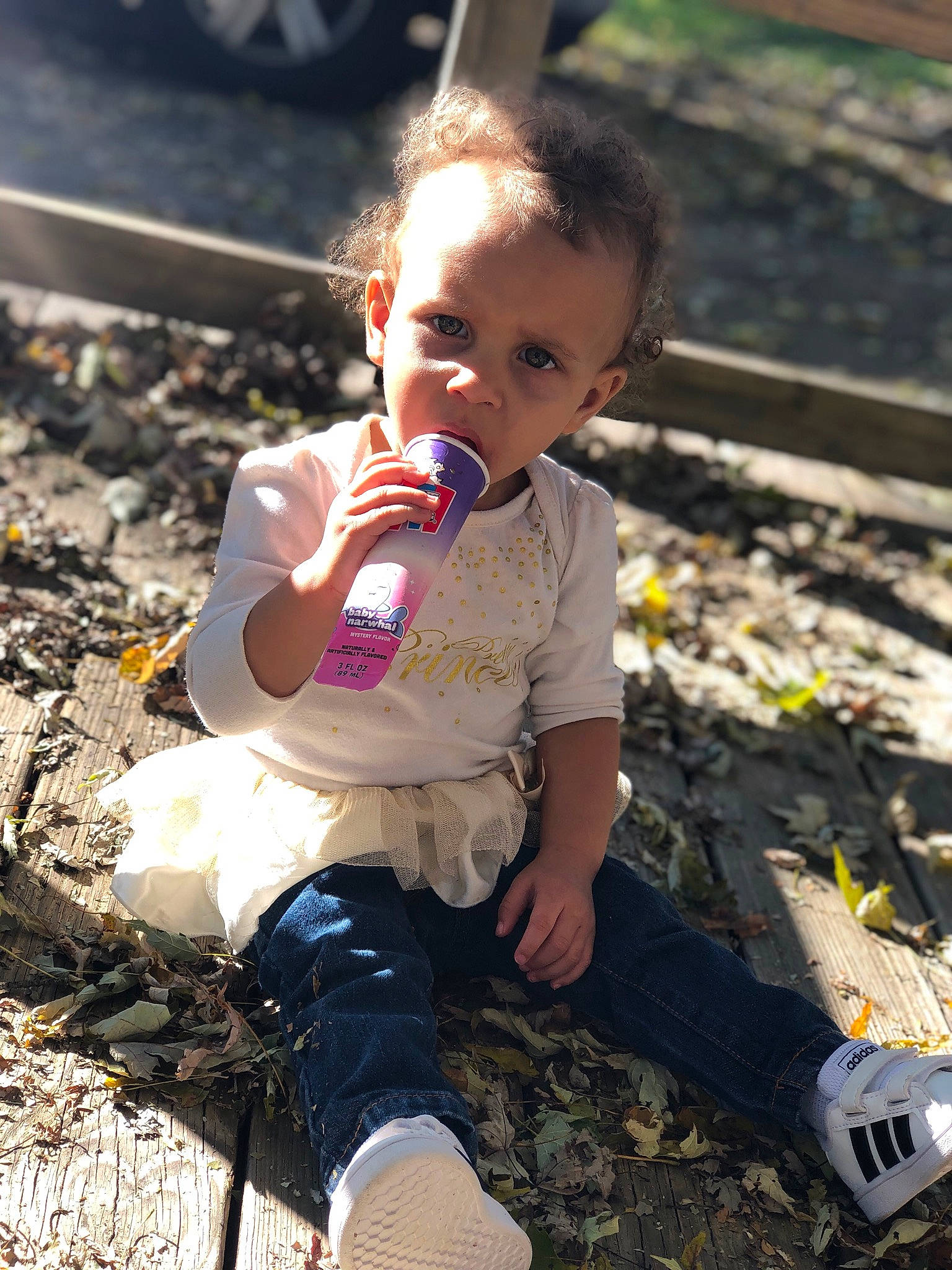 Kayloni joined the competition — help win amazing prizes! adaptation, asphalt, baby, baby_toddler_clothing, boot, child, eye, face, flash_photography, fun, grass, hairstyle, happy, people_in_nature, person, play, sitting, sneakers, soil, toddler