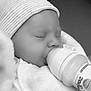 baby, bottle, feeding, sleeping, hat, blanket, infant, cozy, peaceful, closeup, portrait, child, cute, soft, indoor, newborn, clothing, resting, nursery, comfort