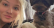 Chloe joined the competition — help win amazing prizes! woman, person, dog, pet, selfie, portrait, indoors, living_room, curtains, window, blanket, couch, sitting, long_hair, blonde_hair, collar, tag, scruffy_dog, companion, cozy