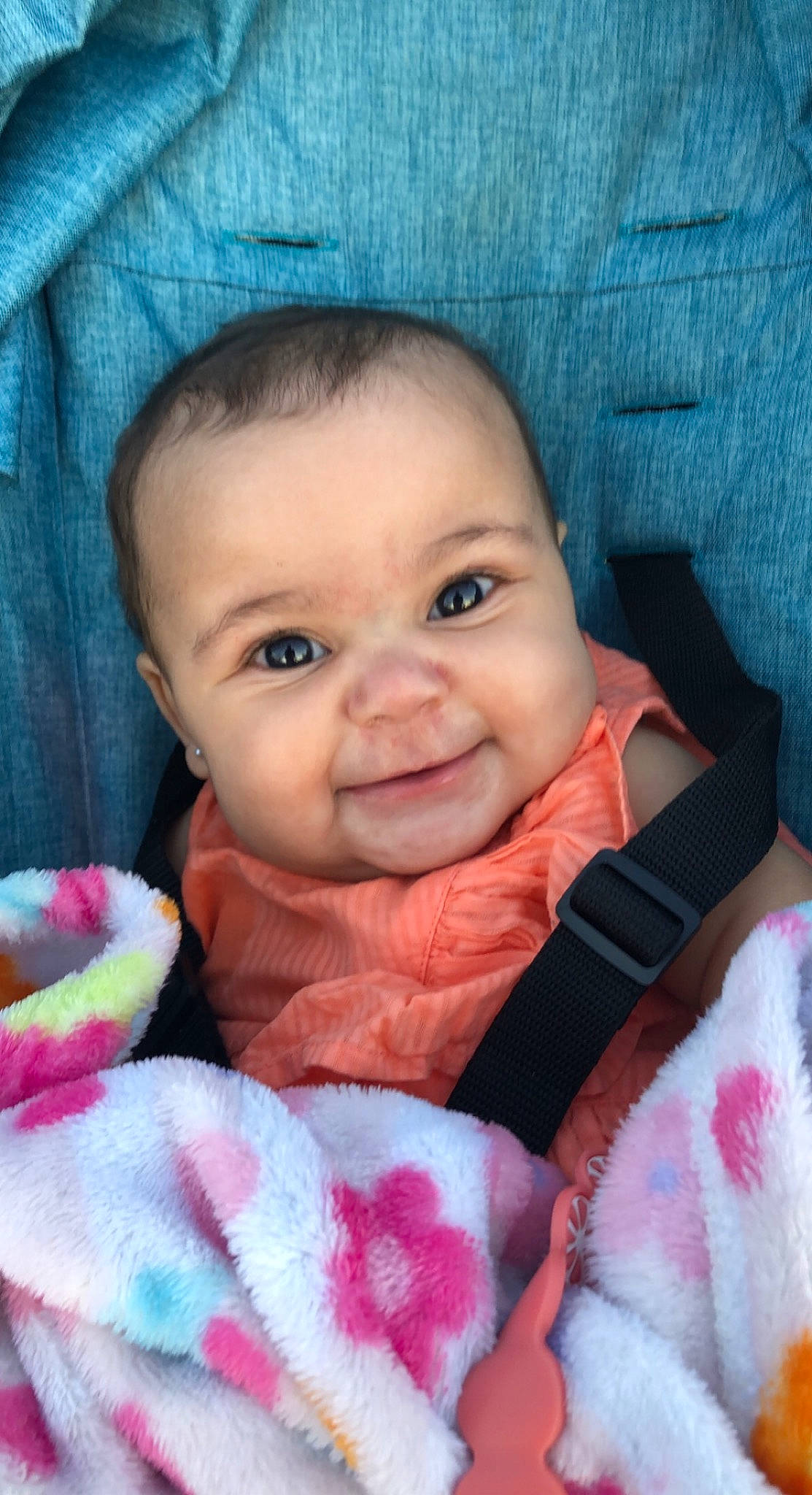 Harmony is registered to the contest to win money with this photo: baby, baby_toddler_clothing, blue, cheek, chin, eye, eyebrow, face, head, iris, lip, mouth, nose, organ, outerwear, person, product, skin, sleeve, smile