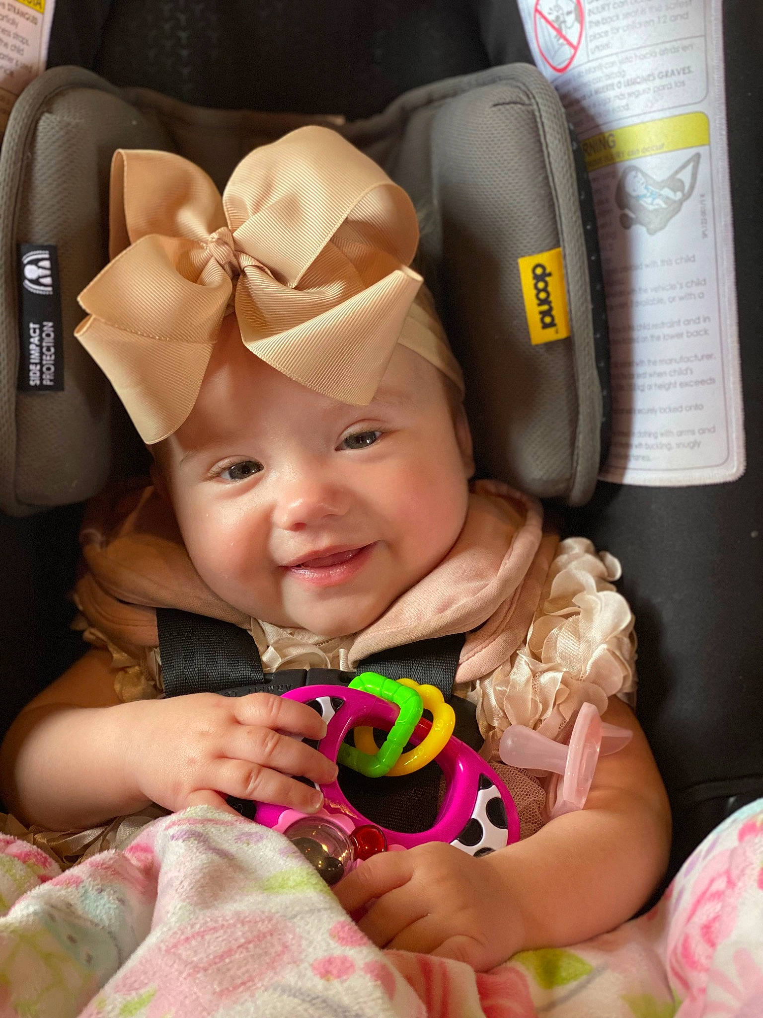 Kimber is registered to the contest to win money with this photo: auto_part, baby, baby_carriage, baby_in_car_seat, baby_products, baby_toddler_clothing, car_seat, cheek, child, comfort, fun, happy, headwear, joy, magenta, person, personal_protective_equipment, pink, product, skin