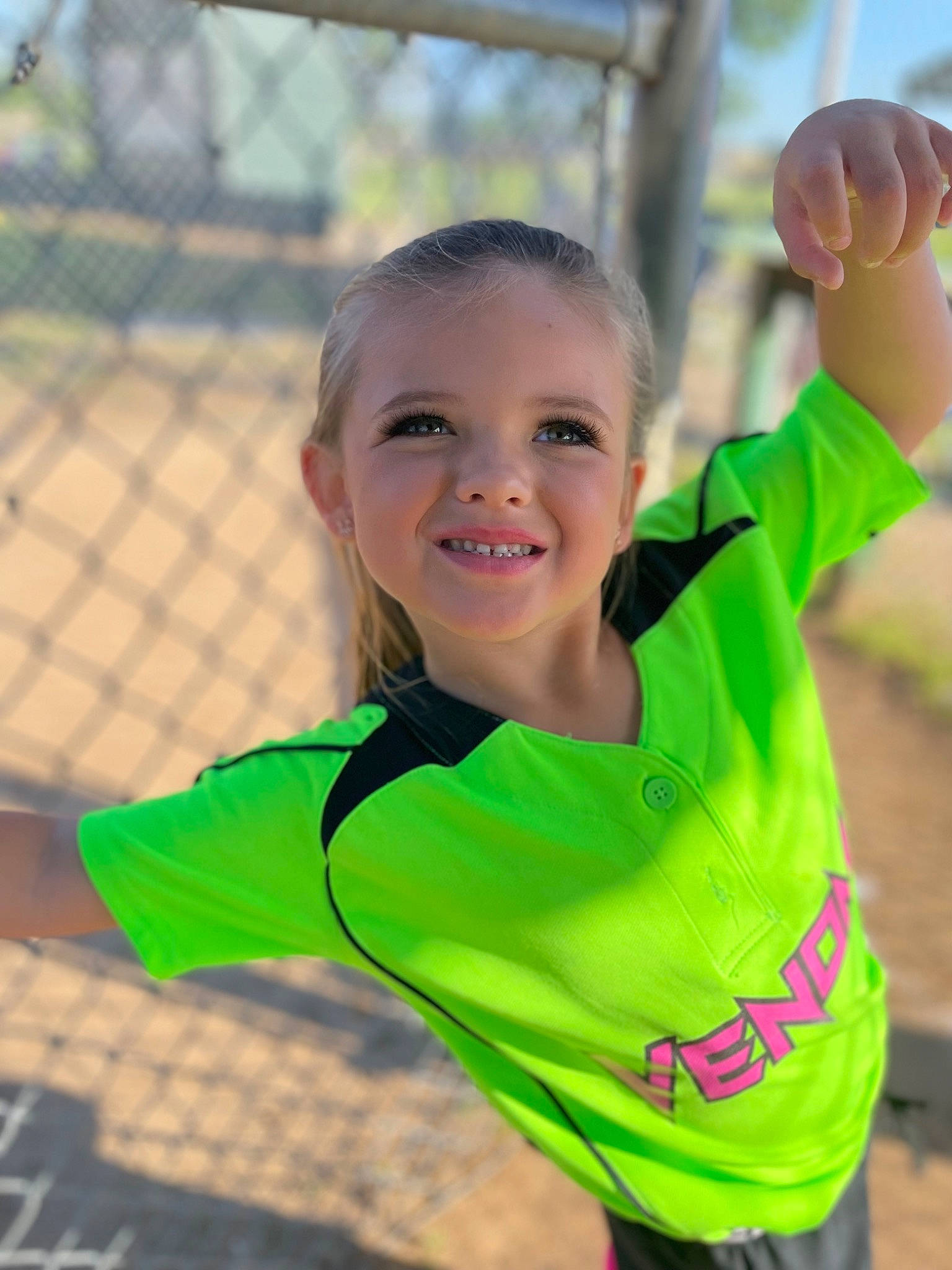 Mila joined the competition — help win amazing prizes! child, face, facial_expression, fun, gesture, grass, happy, joy, leisure, mesh, net_sports, people_in_nature, person, play, player, recreation, sleeve, smile, swing, t_shirt