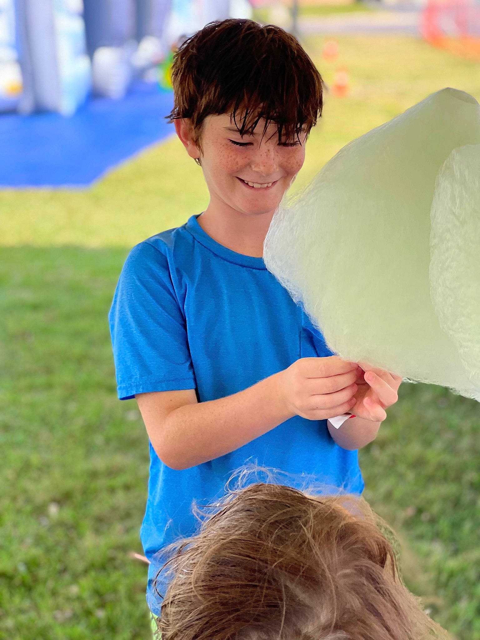 Caiden joined the competition — help win amazing prizes! child, electric_blue, facial_expression, fun, gesture, grass, grassland, hair, happy, joy, leisure, livestock, people_in_nature, person, play, recreation, shirt, sitting, smile, t_shirt