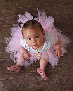 Aila joined the competition — help win amazing prizes! baby, baby_toddler_clothing, ballet_tutu, child, costume, costume_accessory, fashion_accessory, footwear, hair_accessory, headpiece, person, pink, product, shoe, toddler