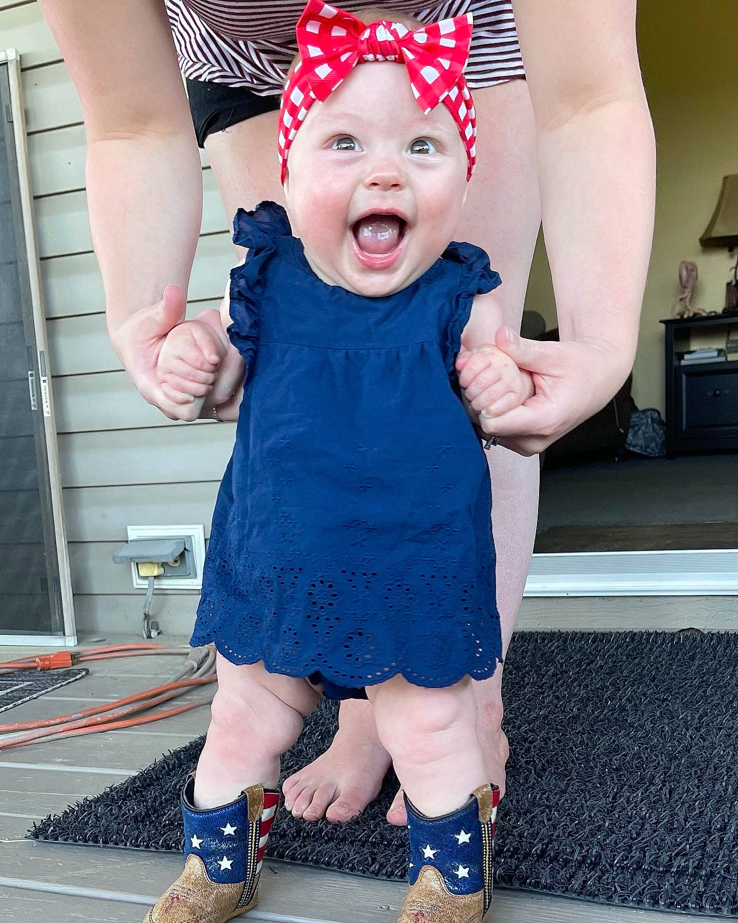 Emberlyn joined the competition — help win amazing prizes! arm, baby_toddler_clothing, blue, cap, dress, gesture, happy, hat, headwear, interaction, leg, person, photograph, pink, red, sleeve, smile, standing, style, textile