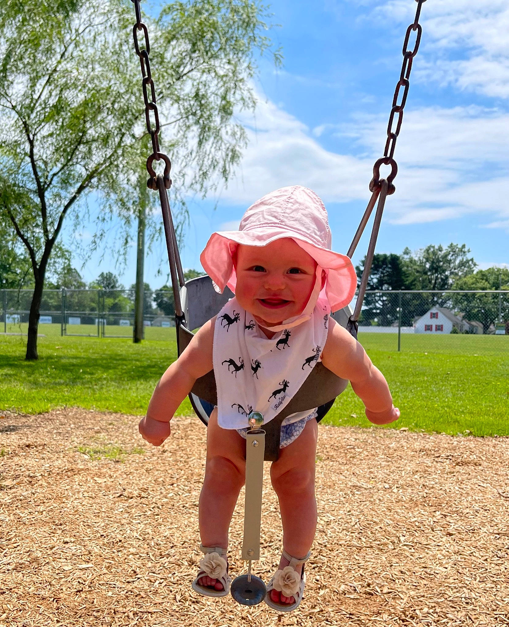 Emberlyn joined the competition — help win amazing prizes! baby_toddler_clothing, child, cloud, fun, grass, happy, hat, headwear, joy, landscape, leaf, leisure, outdoor_play_equipment, people_in_nature, person, plant, playground, recreation, sky, sun_hat