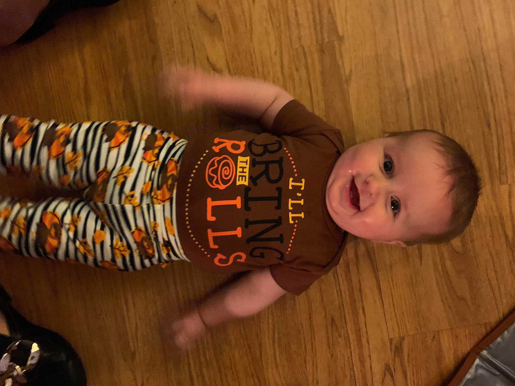 Joel is registered to the contest to win money with this photo: baby, baby_toddler_clothing, brown, child, drink, elbow, finger, flooring, fun, hardwood, joy, pattern, person, sleeve, smile, thumb, toddler, varnish, wood, wood_flooring