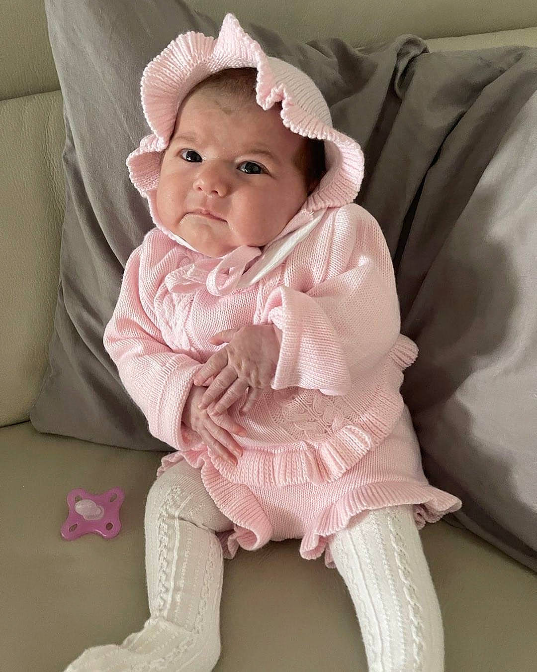 Esmèe joined the competition — help win amazing prizes! baby, baby_toddler_clothing, cheek, child, collar, comfort, embellishment, fashion_accessory, fur, linens, lip, magenta, neck, pattern, person, pink, sitting, skin, sleeve, textile