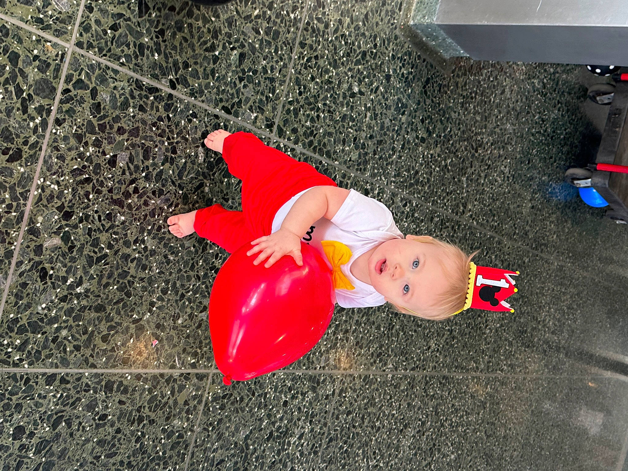 Raiden is registered to the contest to win money with this photo: asphalt, carmine, concrete, flooring, fun, human_leg, person, road_surface, shadow, sidewalk, soil, tar, toy