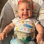 Lyla joined the competition — help win amazing prizes! baby, infant, smiling, child, cute, clothing, onesie, pajamas, baby_seat, pattern, animal_print, face, happy, indoors, person, seat, sun_illustration, monkey_illustration, turtle_illustration, colorful