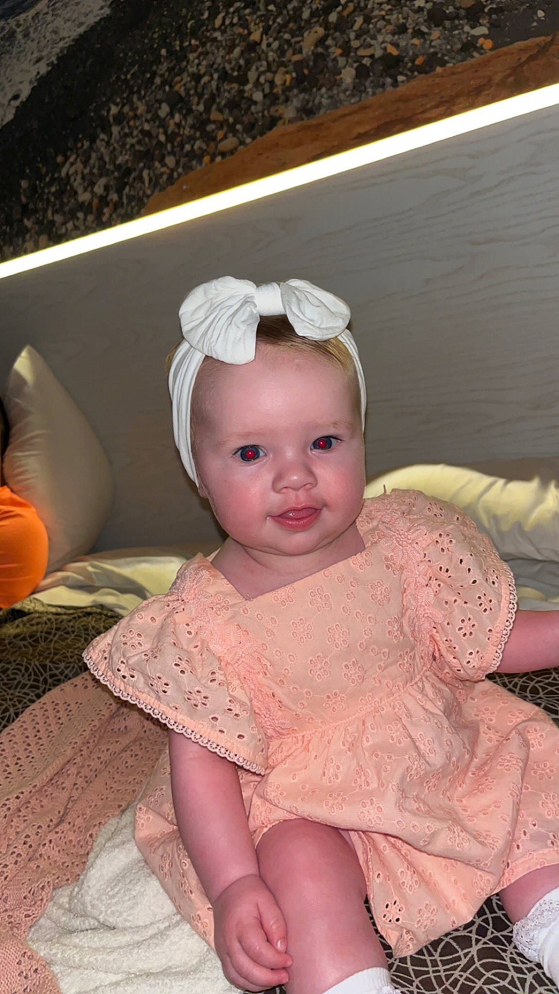 Esmé is registered to the contest to win money with this photo: baby, baby_toddler_clothing, cheek, chin, embellishment, eye, eyebrow, eyelash, flooring, headgear, headpiece, iris, jewellery, lip, neck, person, pink, skin, sleeve, textile