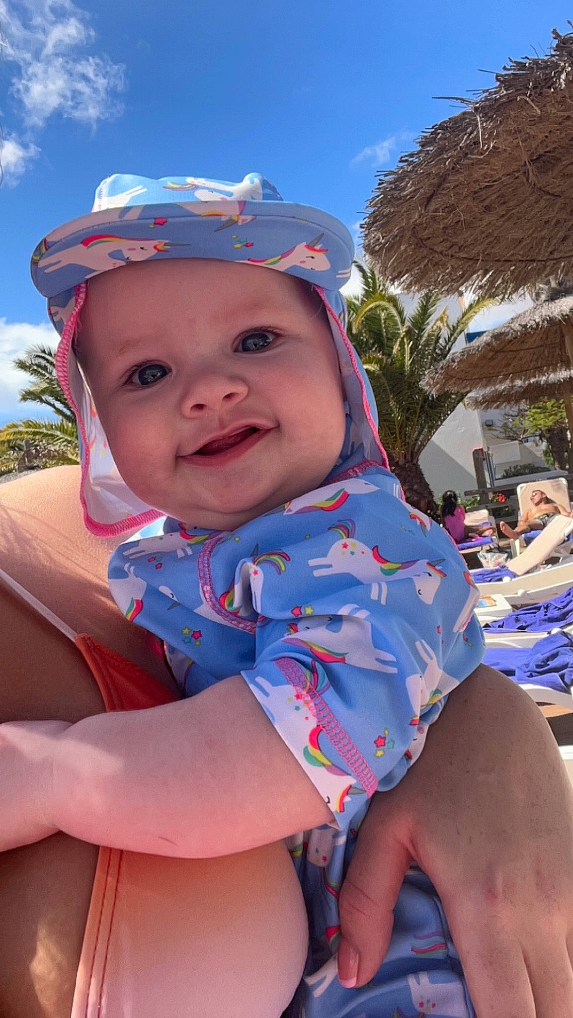 Esmé is registered to the contest to win money with this photo: azure, baby_toddler_clothing, blue, cap, child, cloud, electric_blue, facial_expression, fun, happy, hat, headwear, leisure, person, pink, skin, sky, smile, sun_hat, toddler