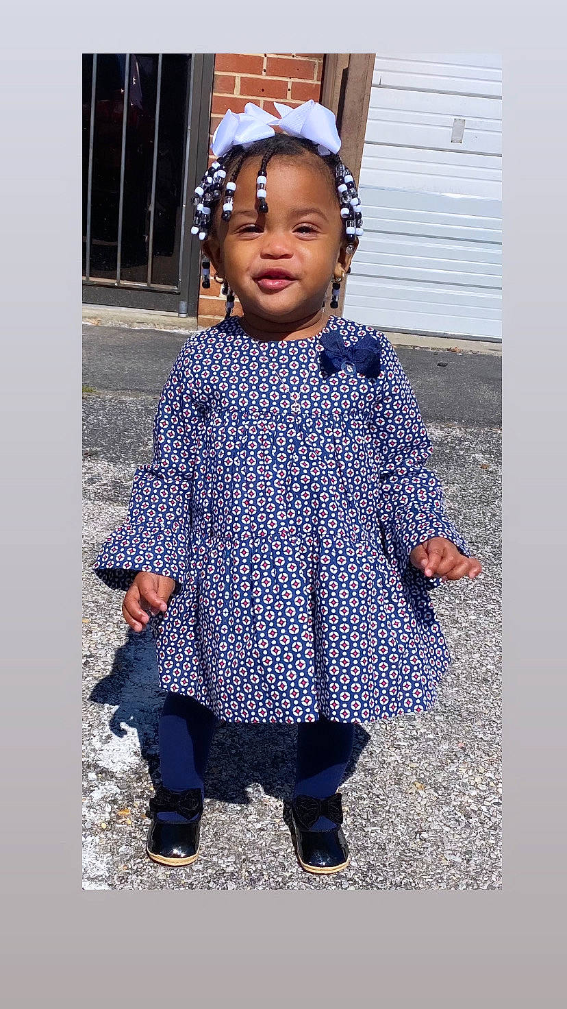 Syriah joined the competition — help win amazing prizes! baby_toddler_clothing, child, cool, electric_blue, face, fun, hairstyle, happy, headgear, outerwear, pattern, person, plaid, purple, sleeve, street_fashion, tartan, textile, toddler, violet