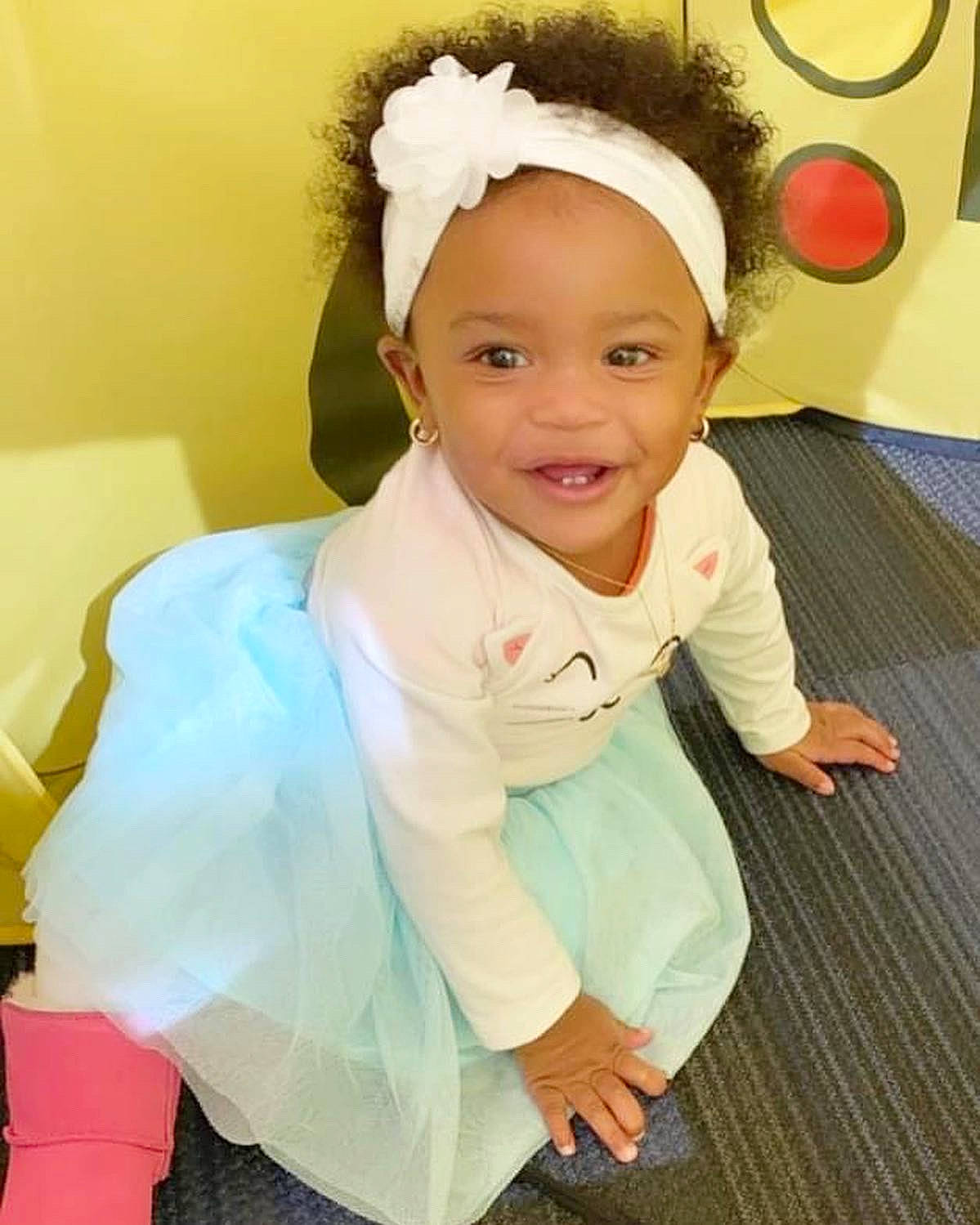 Syriah joined the competition — help win amazing prizes! baby, baby_toddler_clothing, cheek, child, event, face, fashion_accessory, flooring, fun, hair_accessory, happy, headband, headgear, headpiece, iris, joy, person, skin, sleeve, smile