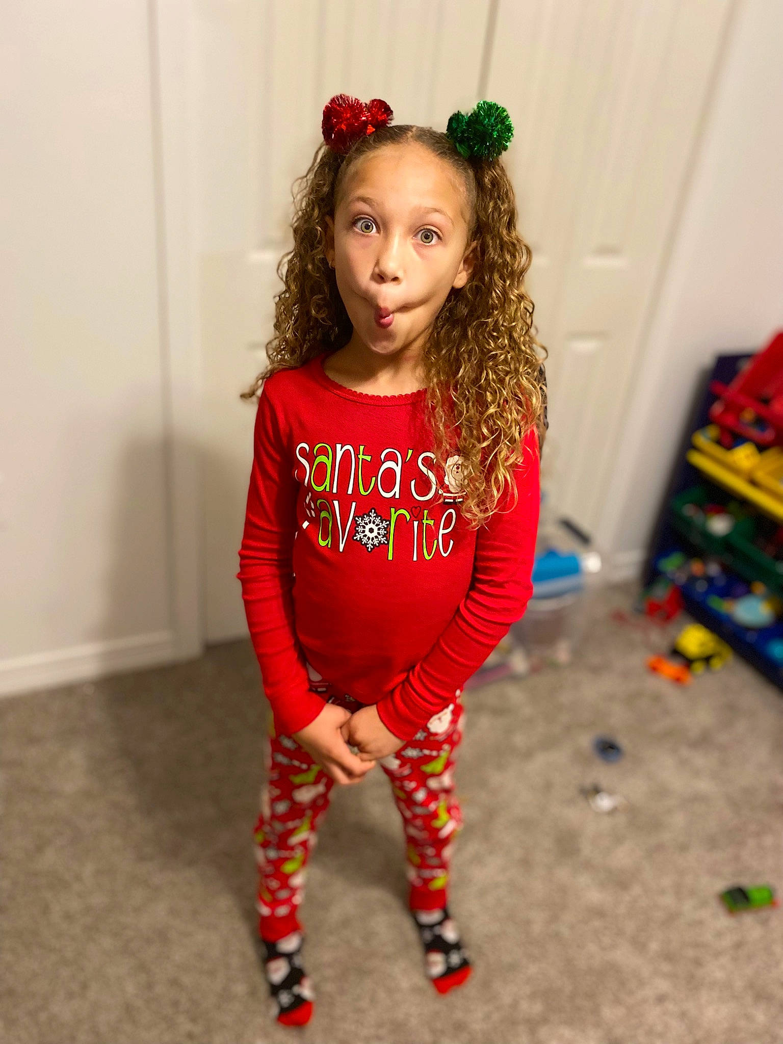 Nevaeh is registered to the contest to win money with this photo: baby_toddler_clothing, child, event, face, fashion_accessory, fashion_design, flooring, happy, head, human_leg, knee, long_hair, neck, pattern, person, sleeve, sportswear, surprise, t_shirt, thigh