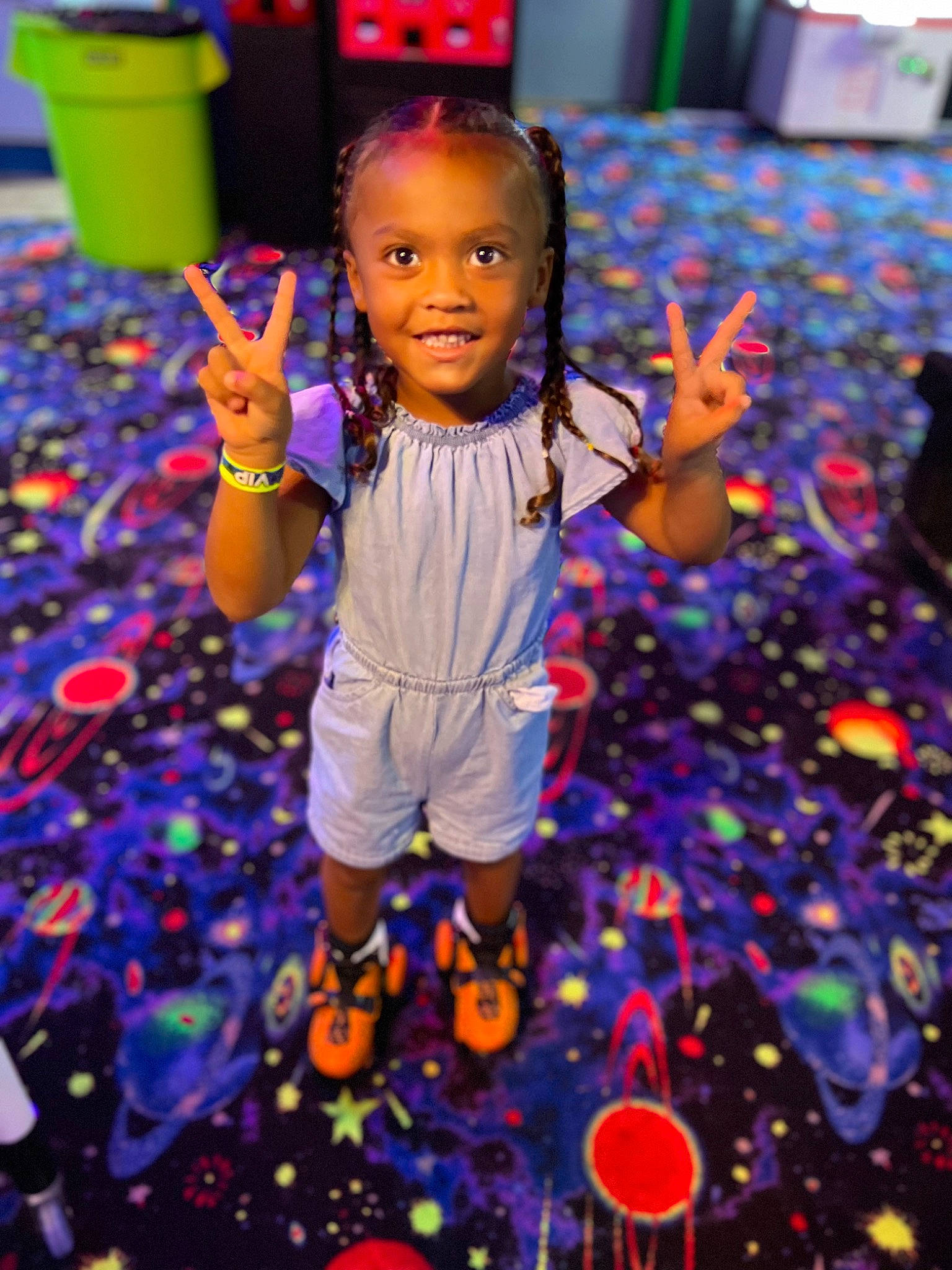 Azariah is registered to the contest to win money with this photo: blue, child, electric_blue, entertainment, event, flooring, fun, happy, joy, leisure, light, lighting, magenta, people_in_nature, person, play, purple, smile, snapshot, t_shirt