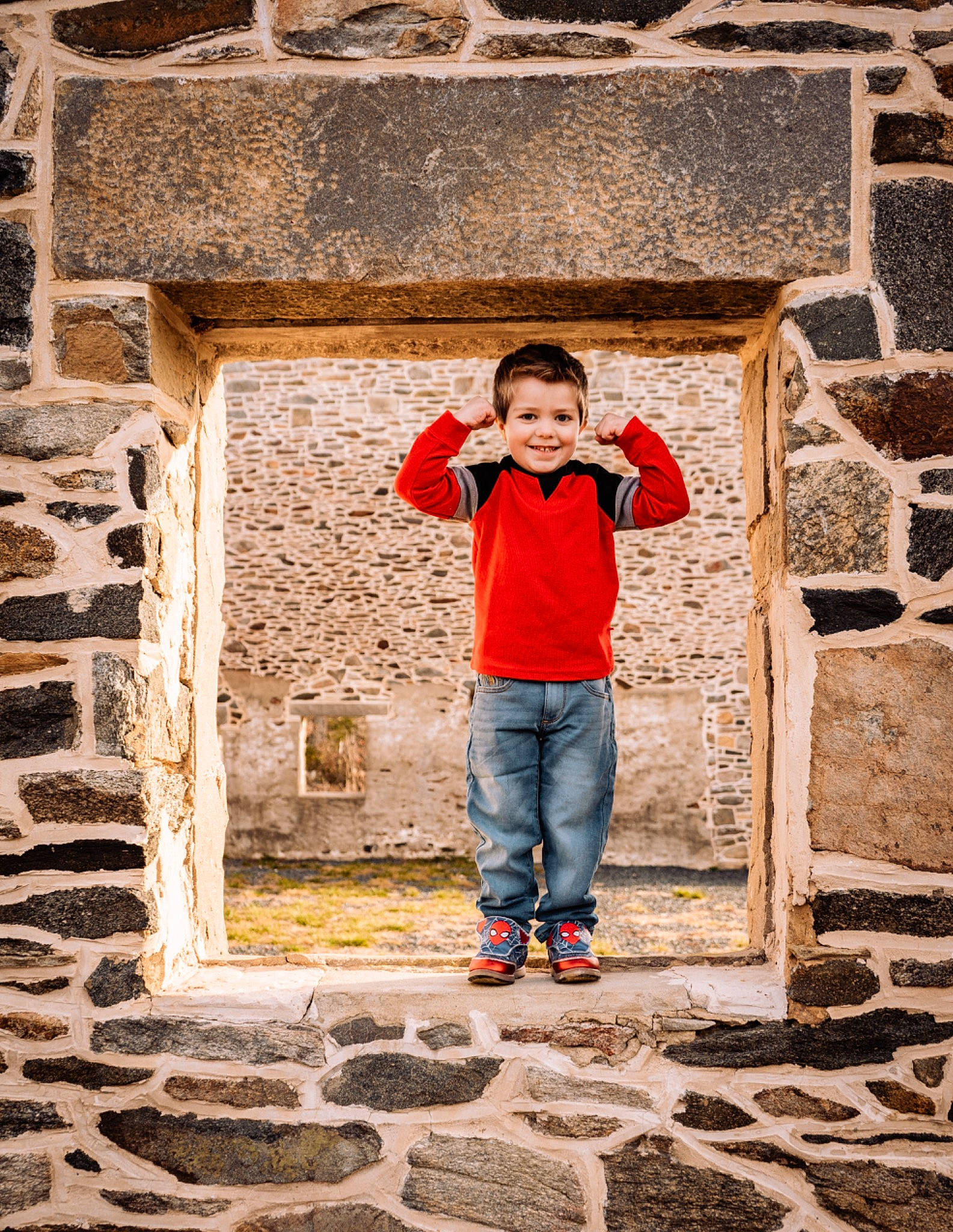 Grayson is registered to the contest to win money with this photo: art, brick, brickwork, child, cobblestone, denim, facade, flash_photography, fun, happy, jeans, joy, people_in_nature, person, smile, stock_photography, stone_wall, symmetry, t_shirt, temple