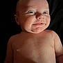 baby, smile, face, skin, head, eyes, mouth, infant, child, portrait, expression, cute, cheek, human, newborn, lying_down, bare_chest, hand, background, dark