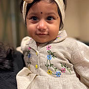 Mithra joined the competition — help win amazing prizes! child, toddler, headband, flower, dress, embroidered, indoor, portrait, cute, smile, person, young_child, fashion, clothing, face, happy, eyes, warm_lighting, baby, headwear