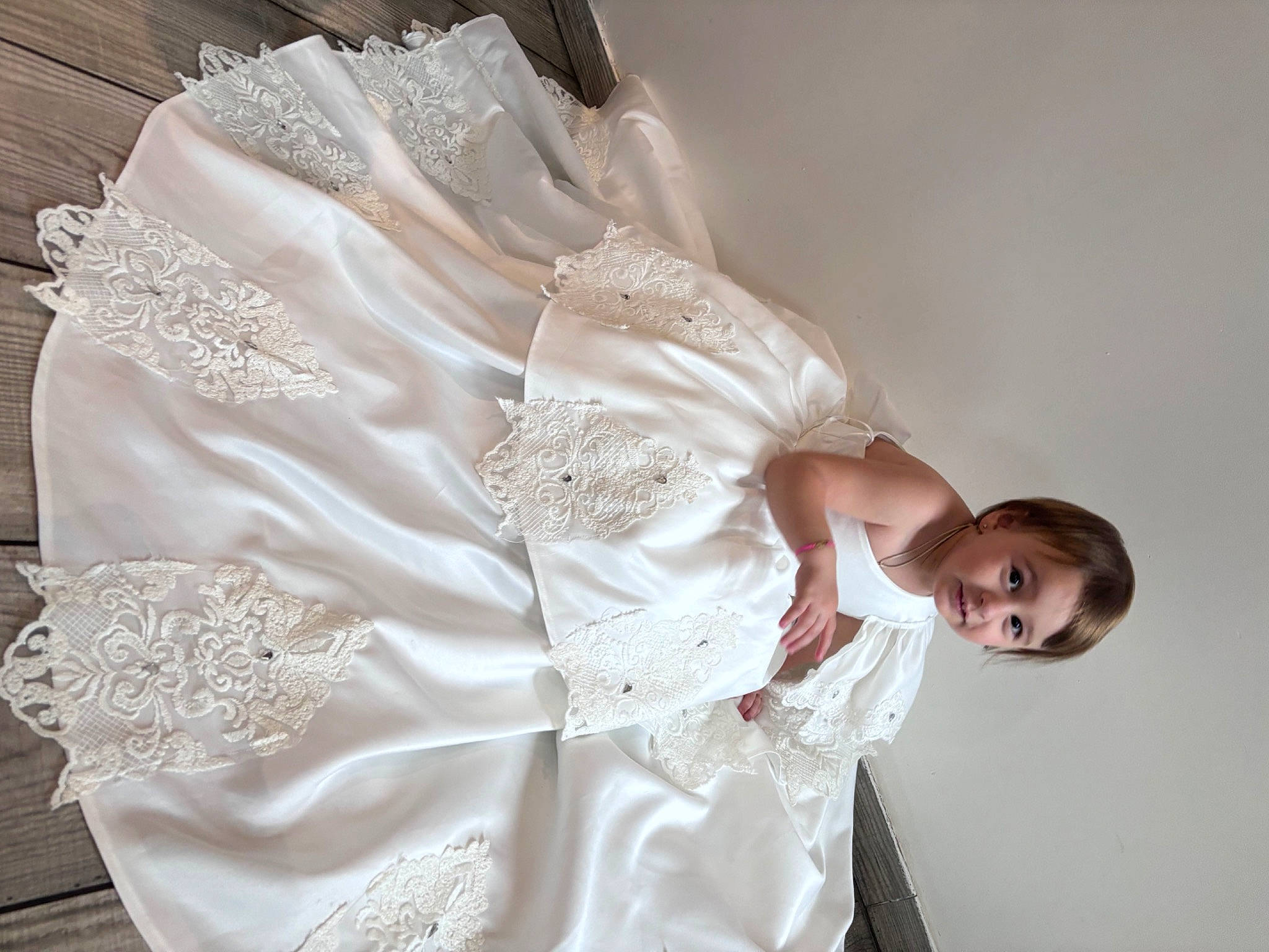 Kayce participe au concours pour gagner de l'argent avec cette photo : abdomen, baby_toddler_clothing, bridal_accessory, day_dress, dress, embellishment, event, fashion_accessory, fashion_design, formal_wear, gown, joy, linens, pattern, peach, person, ruffle, silk, sleeve, waist