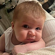 Cohen-Saint is registered to the contest to win money with this photo: baby, infant, face, skin, arm, expression, indoor, resting, curious, soft, blanket, clothing, person, head, closeup, child, young, cute, portrait, relaxation