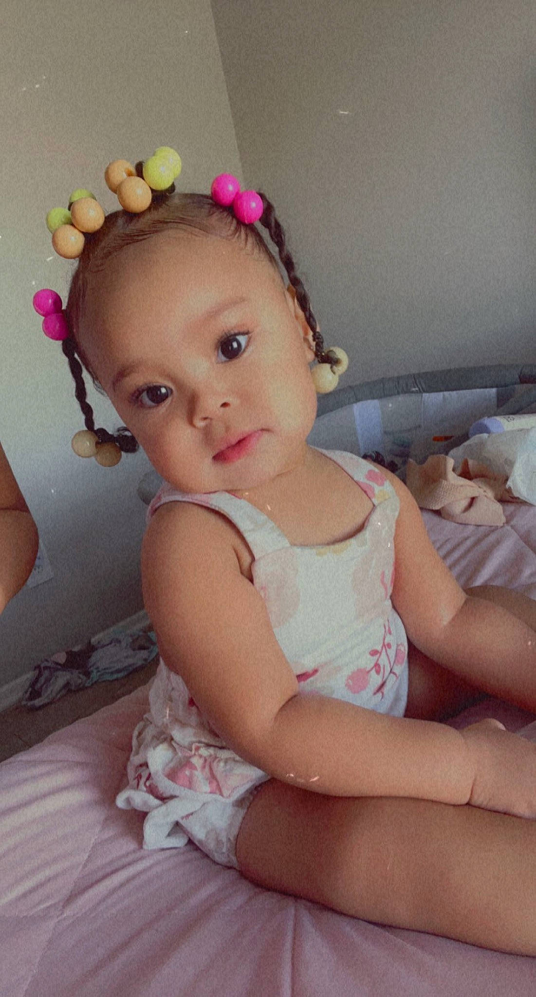 Gabriella is registered to the contest to win money with this photo: arm, baby_toddler_clothing, cheek, chin, dress, eye, eyebrow, eyelash, finger, hair, happy, head, headgear, iris, lip, neck, person, pink, skin, textile