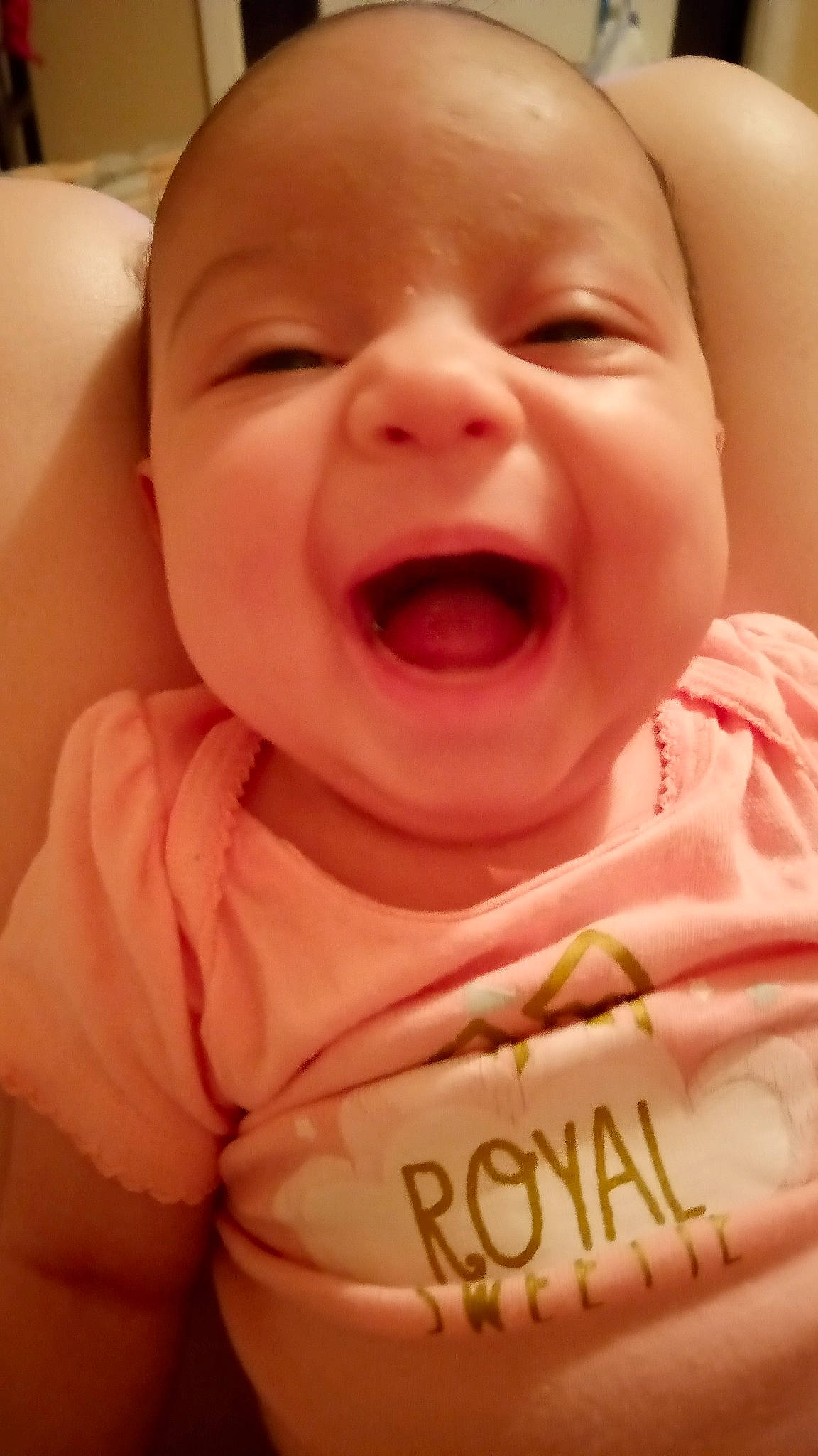 Ciara is registered to the contest to win money with this photo: baby, cheek, chin, eye, eyebrow, facial_expression, finger, gesture, happy, head, jaw, lip, mouth, neck, nose, person, product, skin, sleeve, smile