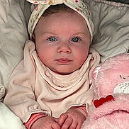 Maddy participe au concours pour gagner de l'argent avec cette photo : baby, infant, headband, blue_eyes, blanket, pink, plush_toy, teddy_bear, clothing, cute, child, portrait, hands, soft, comfort, indoors, person, face, newborn, cozy