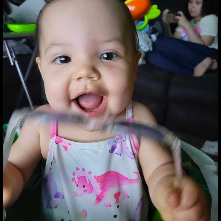 Luna joined the competition — help win amazing prizes! baby, bodypart, cushion, cutlery, face, finger, hand, happy, head, homedecor, laughing, mouth, person, photography, portrait, smile, spoon, teeth, text, toy