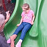 Gracielynn joined the competition — help win amazing prizes! child, slide, playground, green_slide, pink_shoes, jeans, pink_shirt, adult_hand, outdoor, fun, motion_blur, safety, wood_chips, play, happiness, casual_clothing, person, leisure, summer, activity