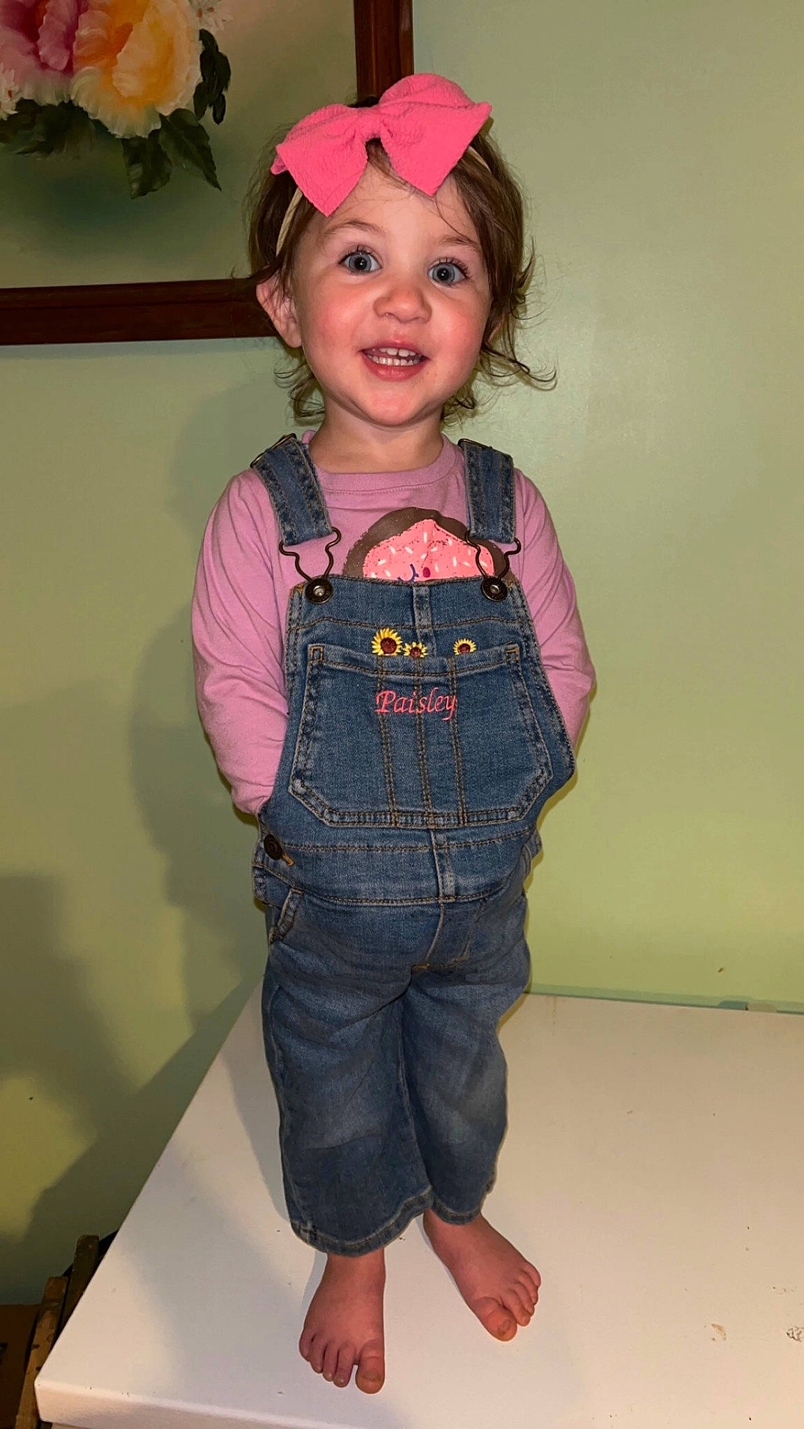 Paisley is registered to the contest to win money with this photo: baby_toddler_clothing, cap, child, clothing, costume_hat, denim, happy, head, headwear, jeans, leg, neck, outerwear, person, pink, sleeve, smile, t_shirt, thigh, toddler