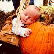 Kolton joined the competition — help win amazing prizes! baby, infant, sleeping, pumpkin, autumn, overalls, hay, gourd, outdoor, fall, nature, cute, peaceful, child, portrait, seasonal, plant, orange, hand, face