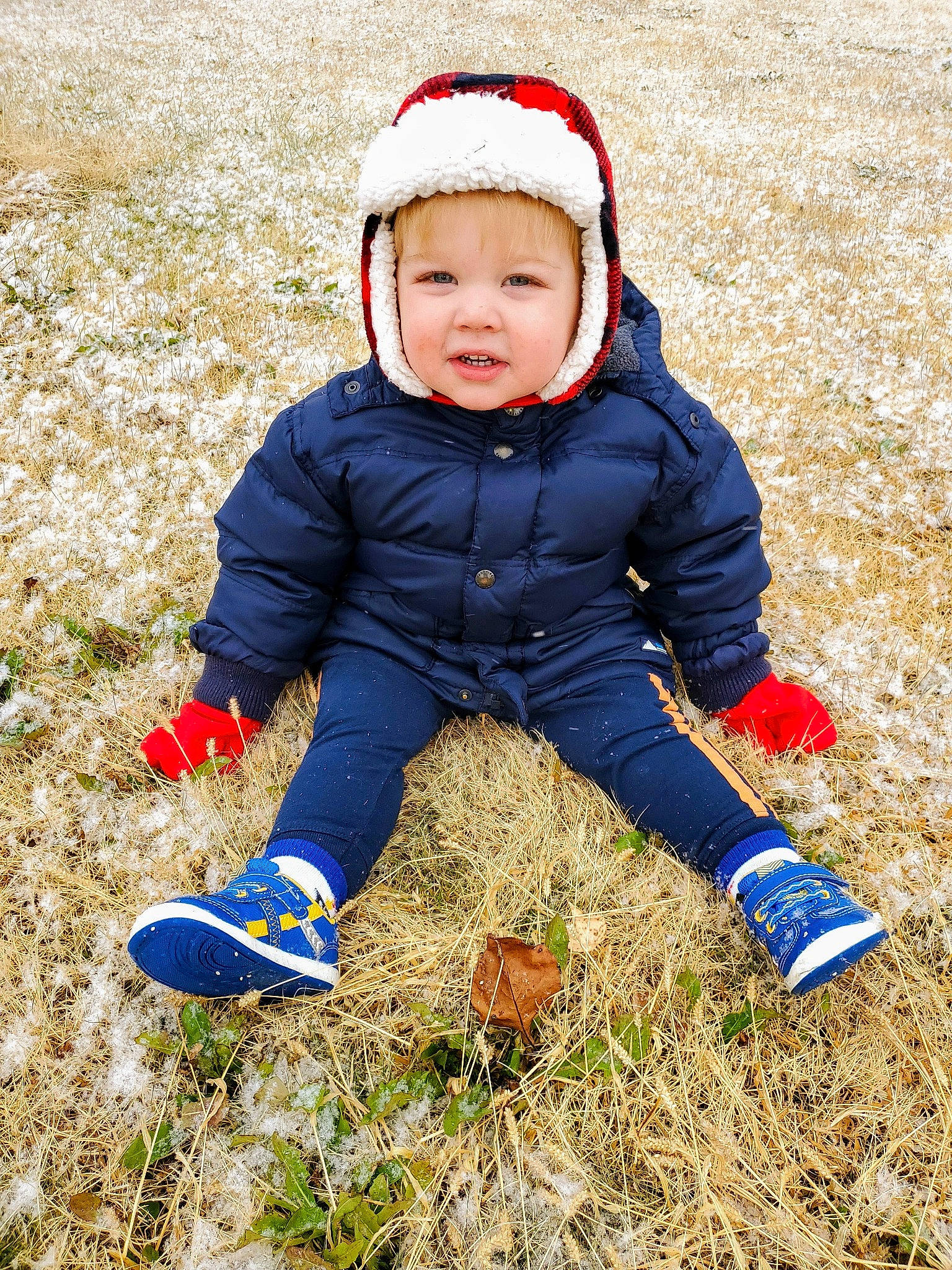 Adam is registered to the contest to win money with this photo: child, fun, grass, happy, headwear, people_in_nature, person, play, playing_in_the_snow, playing_with_kids, smile, toddler