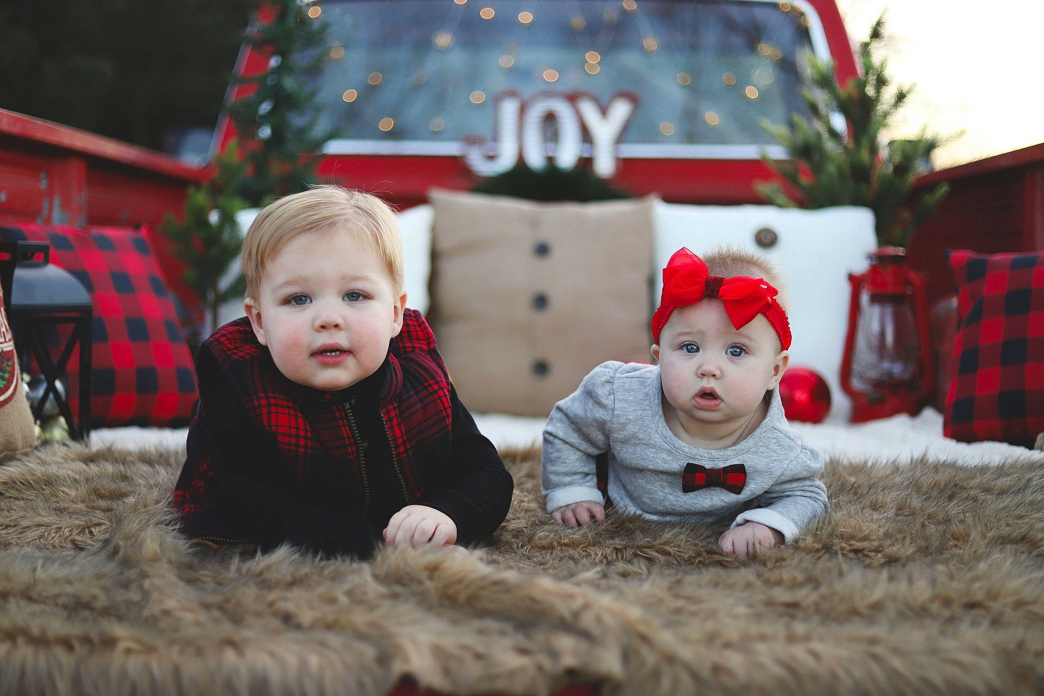 Adam is registered to the contest to win money with this photo: baby, child, christmas, christmas_eve, christmas_ornament, christmas_tree, event, family, fictional_character, fun, happy, holiday, people, person, photograph, photography, sibling, smile, toddler, tree