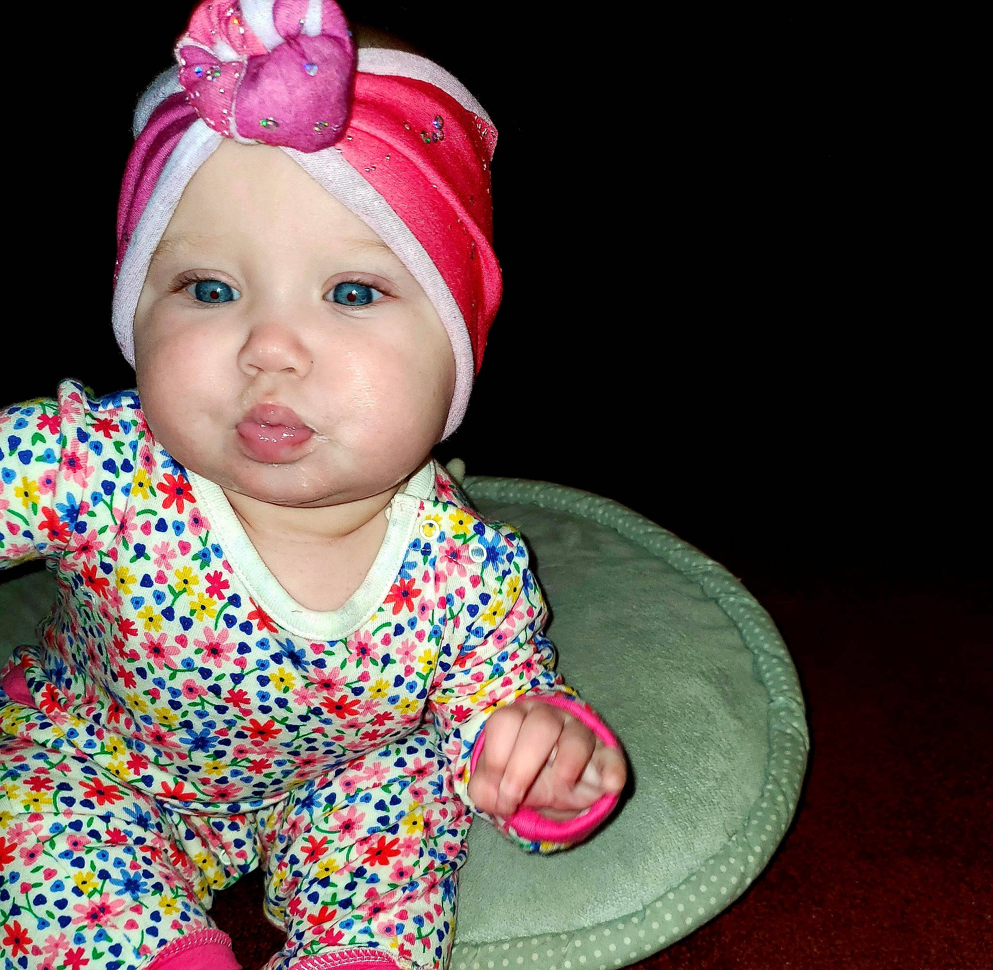 Adelynn is registered to the contest to win money with this photo: baby, bonnet, cheek, child, child_model, clothing, ear, fashion_accessory, fun, hair_accessory, hat, head, headgear, person, pink, toddler