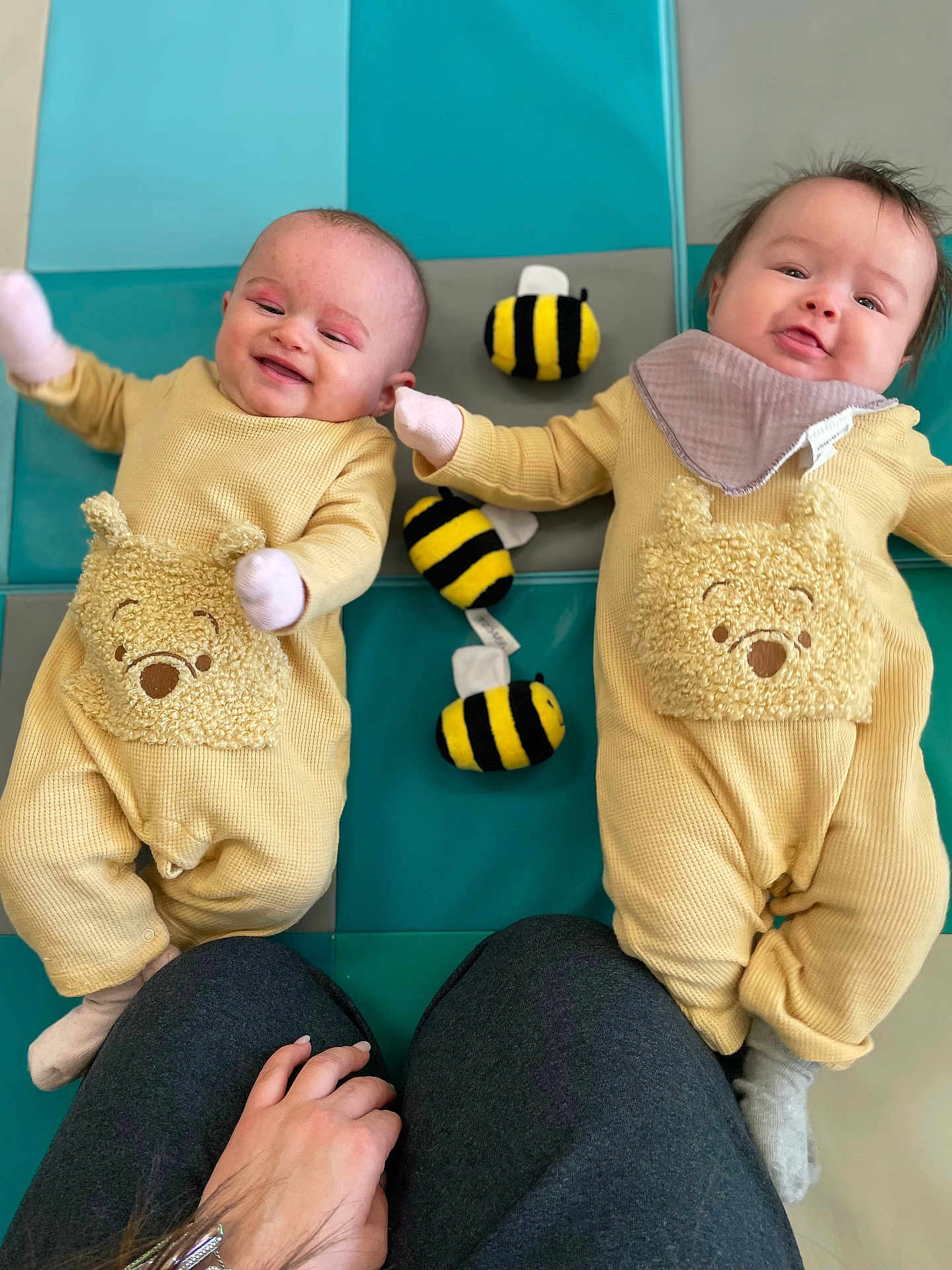 Genesis And Psalm joined the competition — help win amazing prizes! baby, infant, twins, play_mat, bee_toy, plush_toy, yellow_outfit, bib, mittens, smile, happy, parent_hand, knees, pajamas, lying_down, indoor, portrait, cute, playtime, tiles