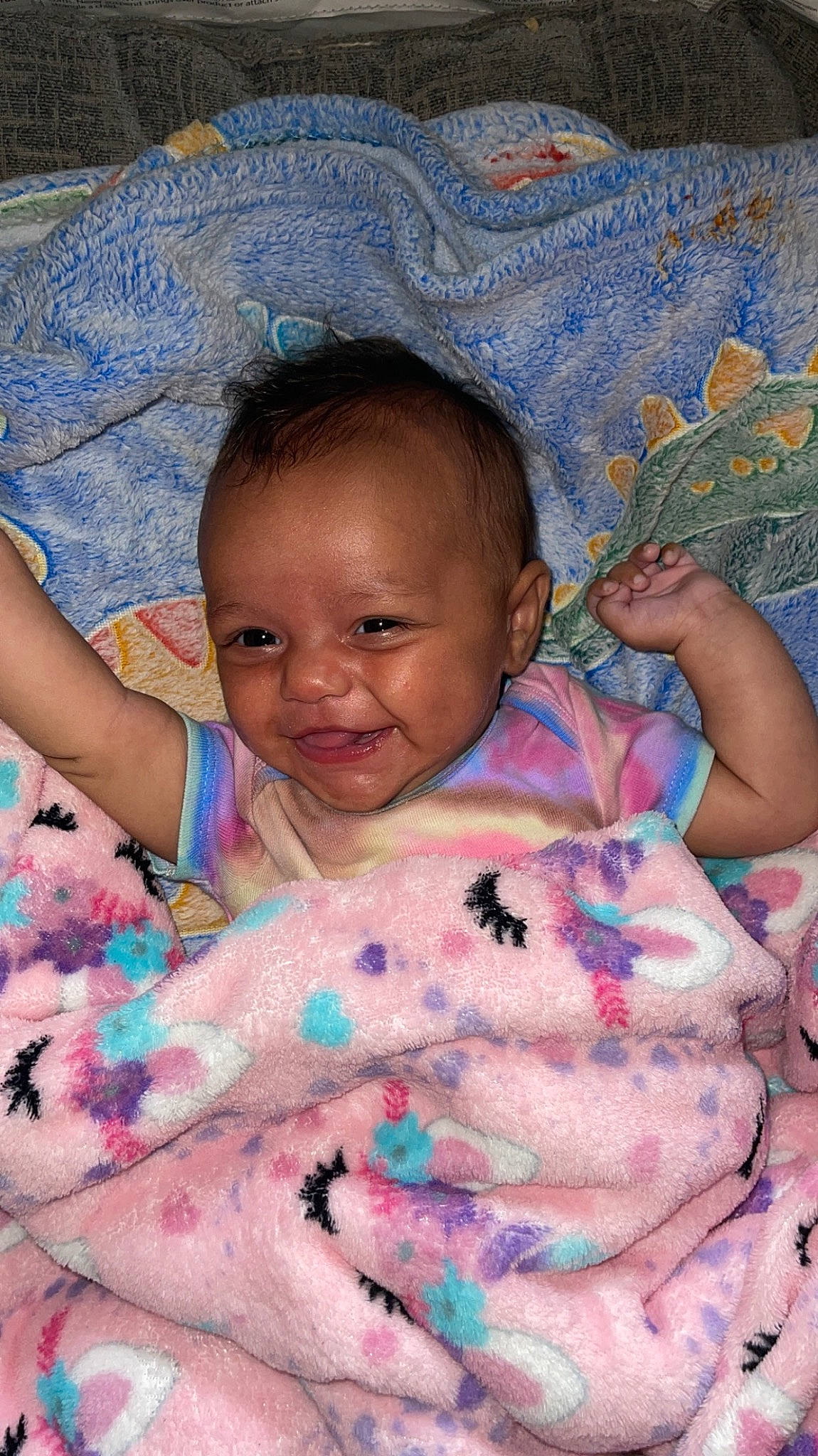 Evelyn is registered to the contest to win money with this photo: arm, baby, cheek, chin, comfort, eye, facial_expression, finger, hairstyle, hand, head, joy, lip, mouth, muscle, nose, person, pink, skin, smile