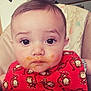 baby, child, face, bib, food, messy, high_chair, monkey_pattern, red_bib, cute, expression, indoor, young, person, infant, small_child, feeding, messy_face, clothing, portrait
