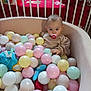 Charlie participe au concours pour gagner de l'argent avec cette photo : baby, blanket, child, cozy, crib, cute, face, indoor, infant, pacifier, pastel_colors, person, plastic_balls, play, playpen, room, smiling, soft_furniture, toddler, toy