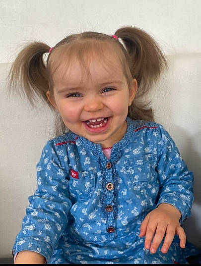 Eden participe au concours pour gagner de l'argent avec cette photo : arm, baby_toddler_clothing, cheek, ear, eye, hair, head, human_body, iris, joint, joy, neck, outerwear, person, product, purple, shoulder, skin, sleeve, smile