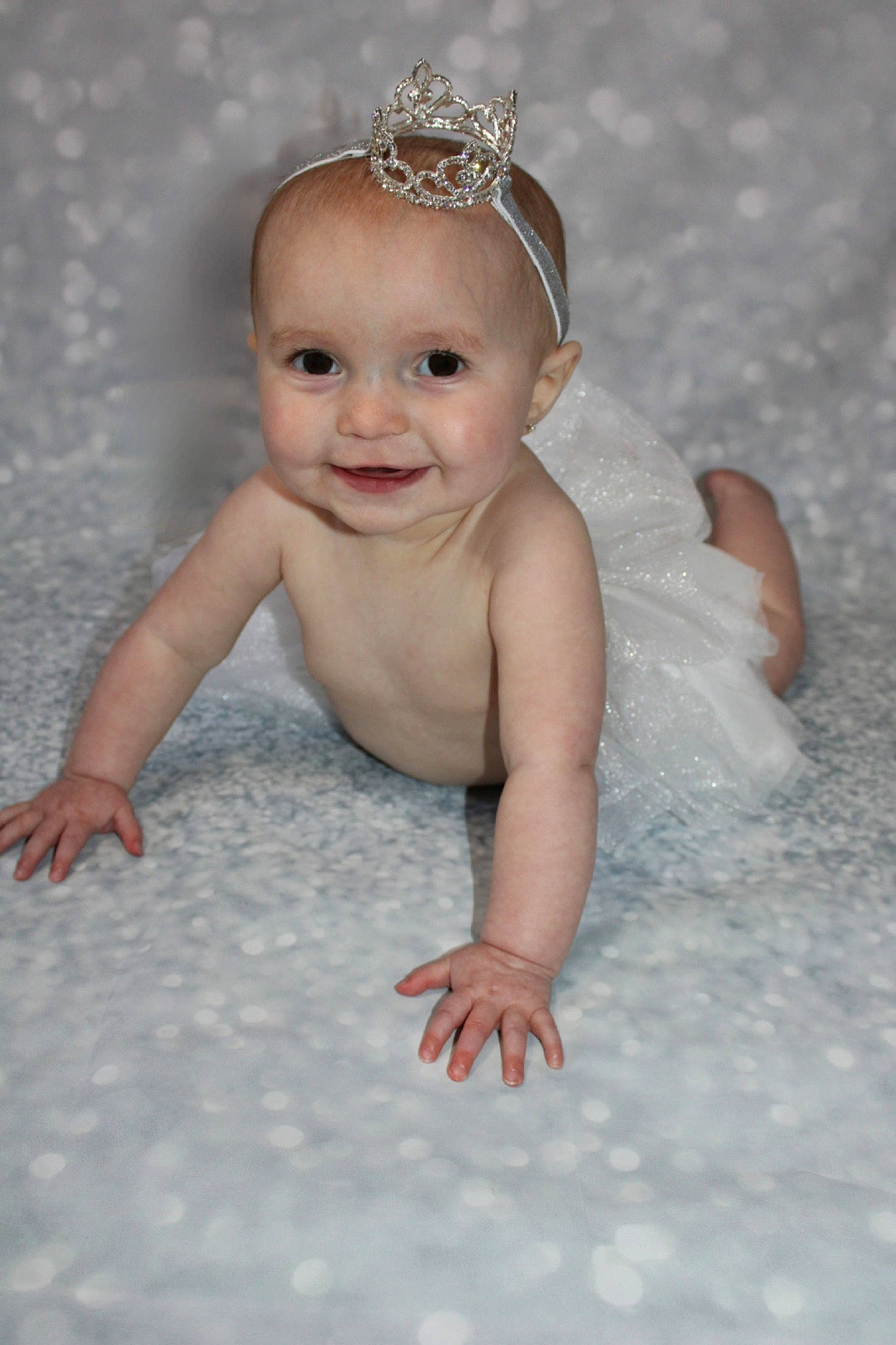 Samara joined the competition — help win amazing prizes! baby, baby_toddler_clothing, blond, bridal_accessory, child, ear, embellishment, eye, flash_photography, flooring, fun, happy, headband, headpiece, jewellery, joy, necklace, person, skin, smile