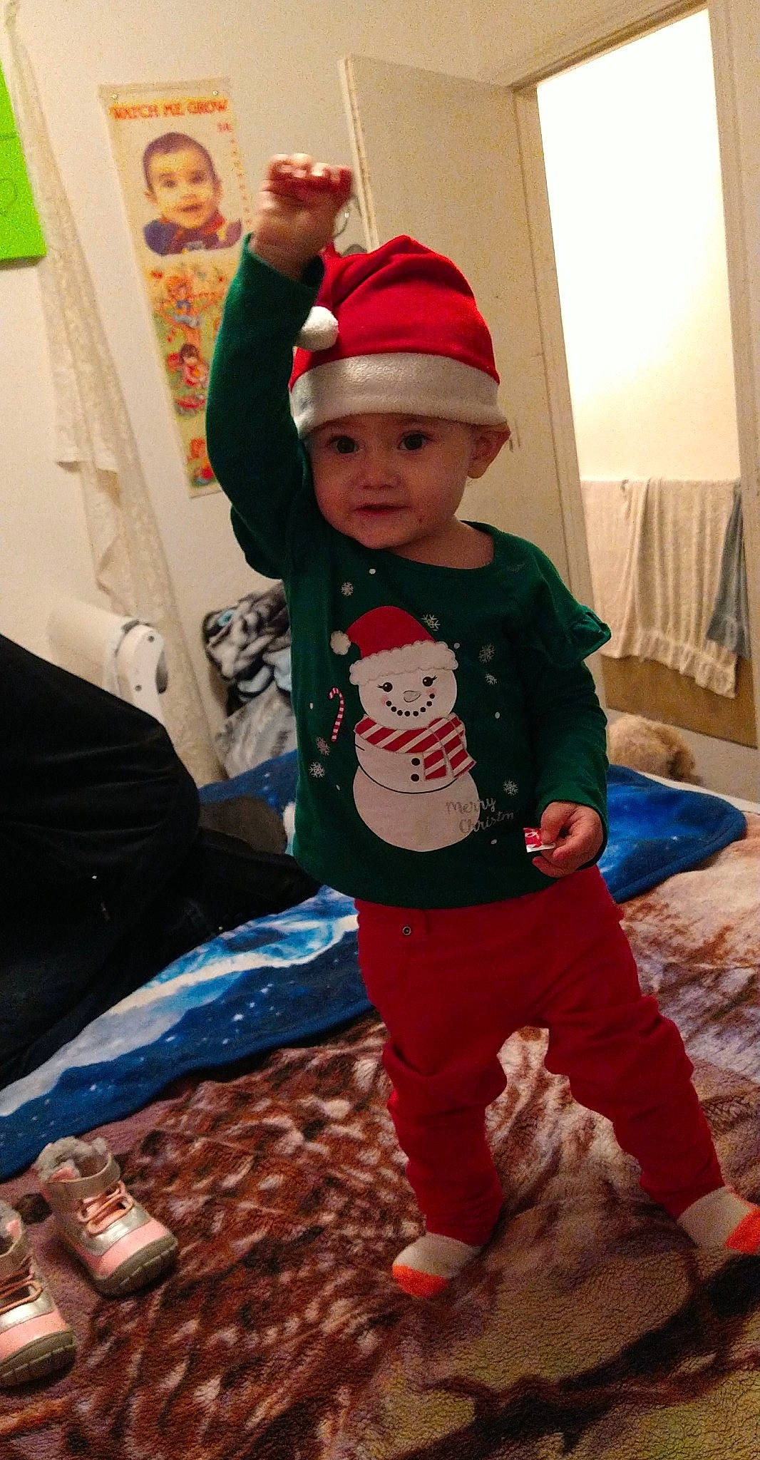 Alia joined the competition — help win amazing prizes! baby, baby_toddler_clothing, bonnet, child, christmas, costume_accessory, costume_hat, headwear, interior_design, living_room, nightwear, pajamas, person, pillow, room, sock, sweatpant, toddler