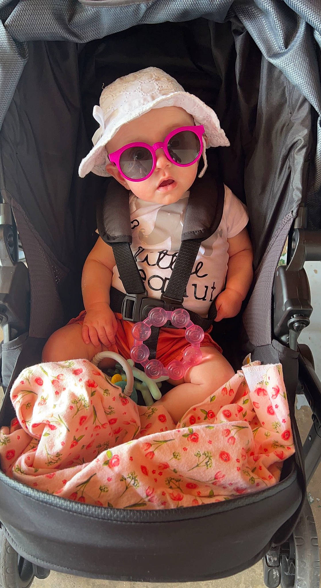 Brylee is registered to the contest to win money with this photo: arm, baby, baby_carriage, baby_toddler_clothing, beauty, cap, child, dress, eyewear, fashion, glasses, goggles, leg, person, pink, product, sleeve, sneakers, sunglasses, toddler
