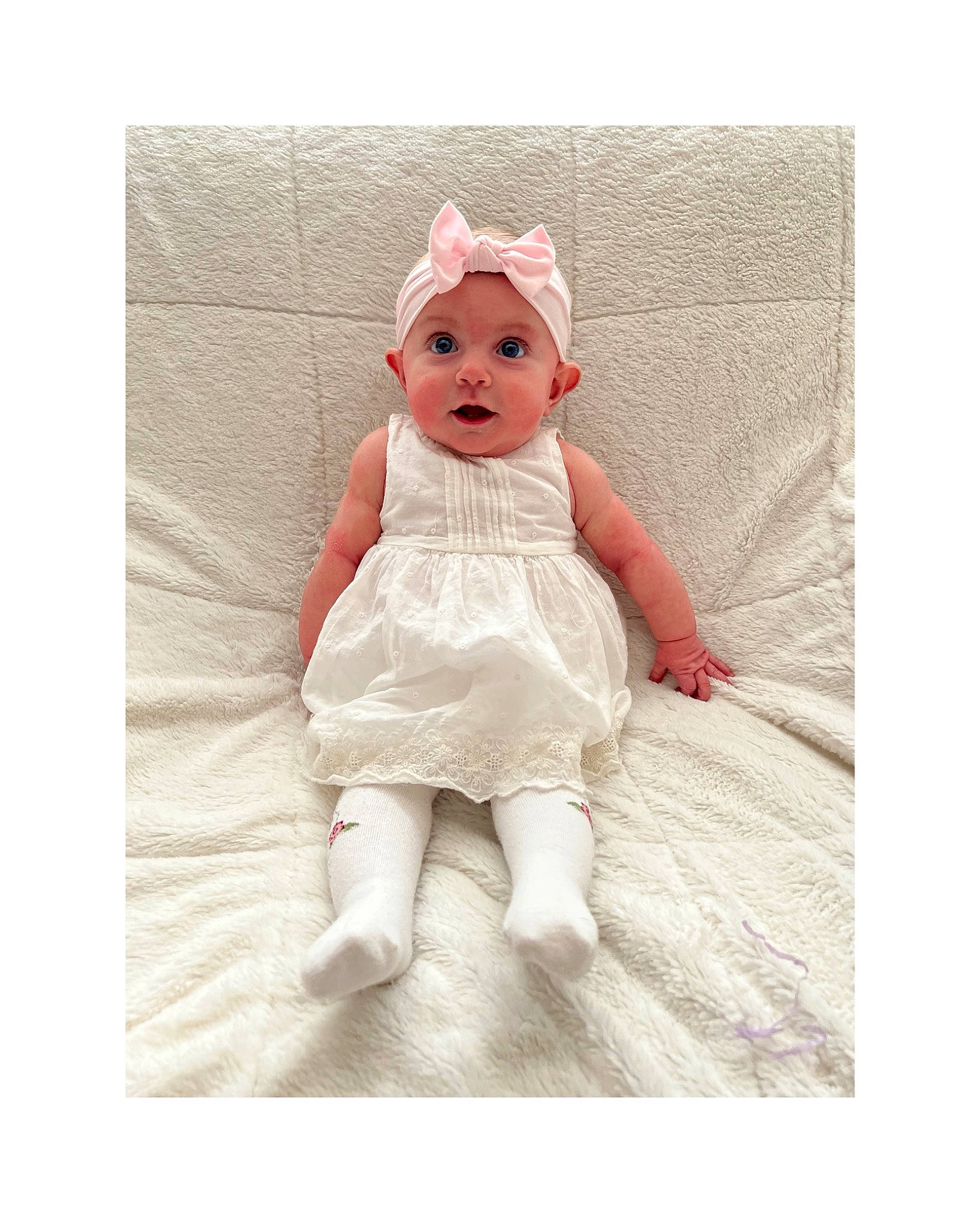 Brylee is registered to the contest to win money with this photo: arm, baby, baby_products, baby_toddler_clothing, baby_toys, costume_hat, dress, fashion_accessory, fur, happy, head, headgear, headpiece, headwear, human_body, linens, peach, person, sleeve, smile