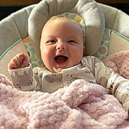 Maliyah joined the competition — help win amazing prizes! baby, smiling, blanket, pink, cushion, infant, happy, cozy, soft, clothing, sitting, face, indoors, child, portrait, cute, warm, newborn, comfort, expression
