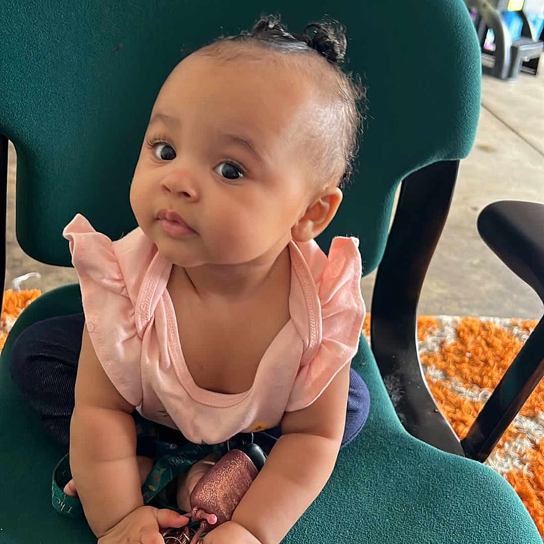 Kehlani is registered to the contest to win money with this photo: accessories, baby, blackhair, bodypart, bracelet, chair, clothing, face, furniture, hair, handcuffs, happy, head, jewelry, person, photography, portrait, sitting, sleeve, smile