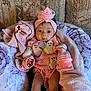 Keonna Marie joined the competition — help win amazing prizes! baby, infant, pink, headband, pacifier, blanket, cushion, smiling_ghost_patches, clothing, face, person, cute, indoors, seated, fabric, soft_toys, comfort, portrait, young_child, sleepwear